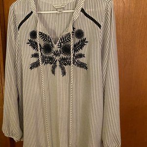 Black and white striped shirt with black embroidered flower and tie neck